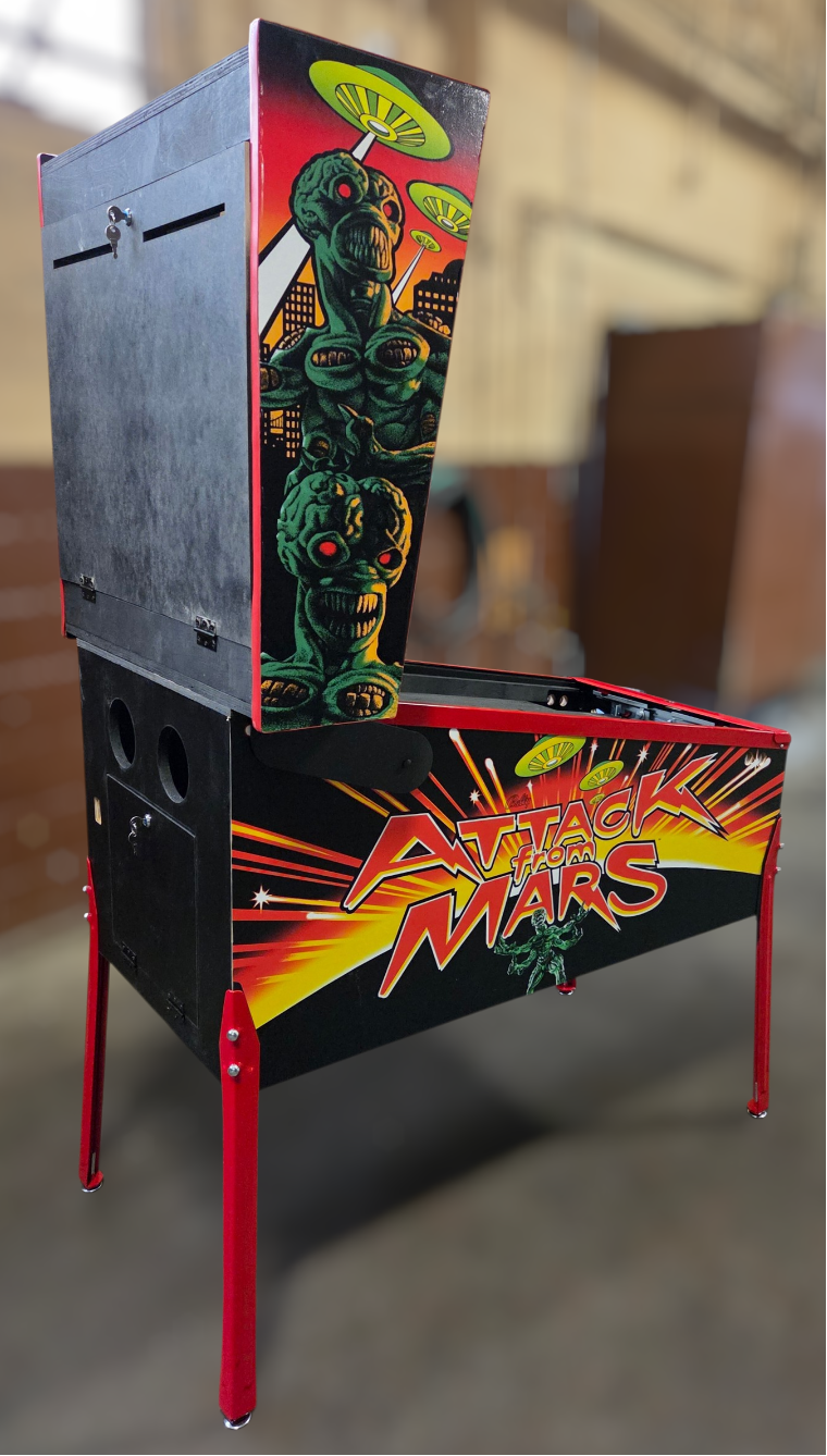 virtual Pinball machine with 'Atomic Warriors' design in an indoor setting